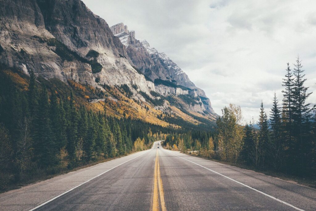 country-road-along-rocky-mountains-royalty-free-image-678834219-1550781633